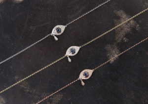 Taylor & Hart 9ct gold, white diamond, black diamond and blue sapphire Evil Eye Teardrop bracelets