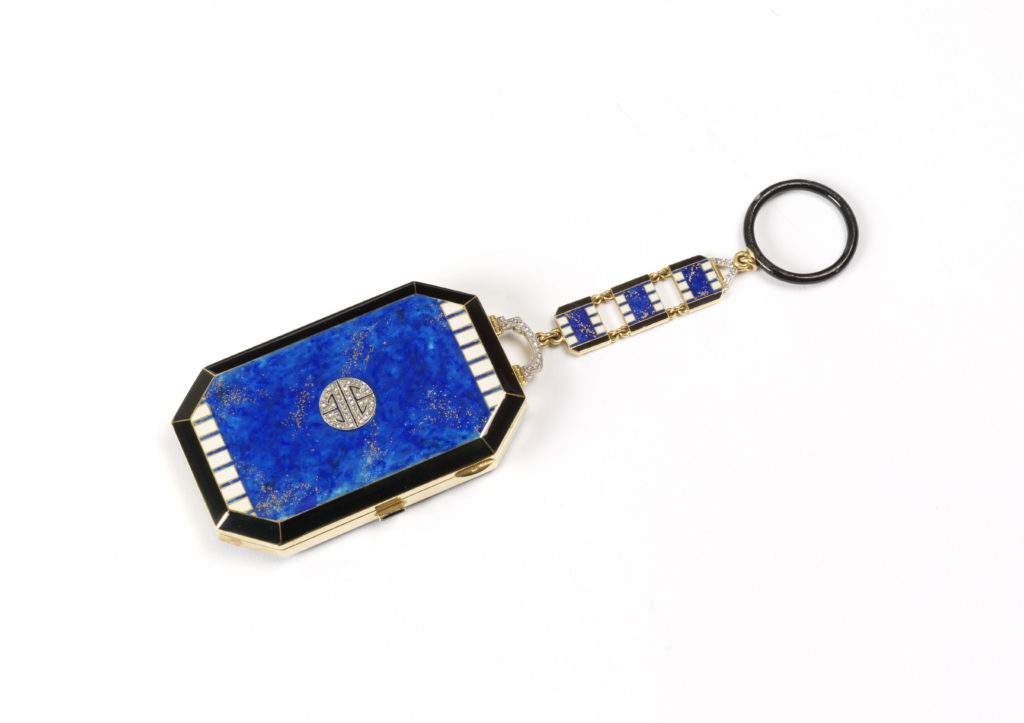 Gold vanity case decorated with blue, black and white enamel and diamonds made by Lacloche in 1925, part of the Kashmira Bulsara collection at the V&A Museum