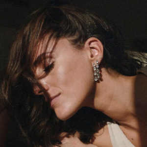 Catarina Mira wearing a set of pear-shaped diamond drop earrings created by Bespoke by MB 