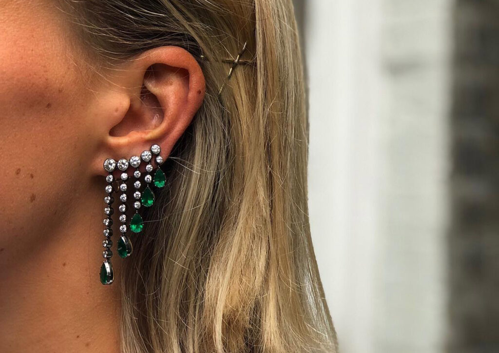Threads Styling Harriet Hedges wearing Jessica McCormack earrings